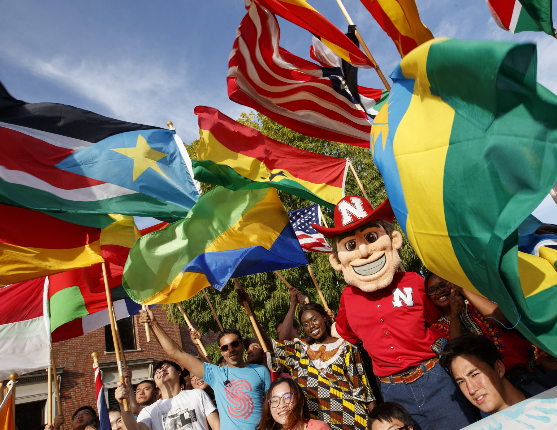 Herbie Husker with international students at UNL
