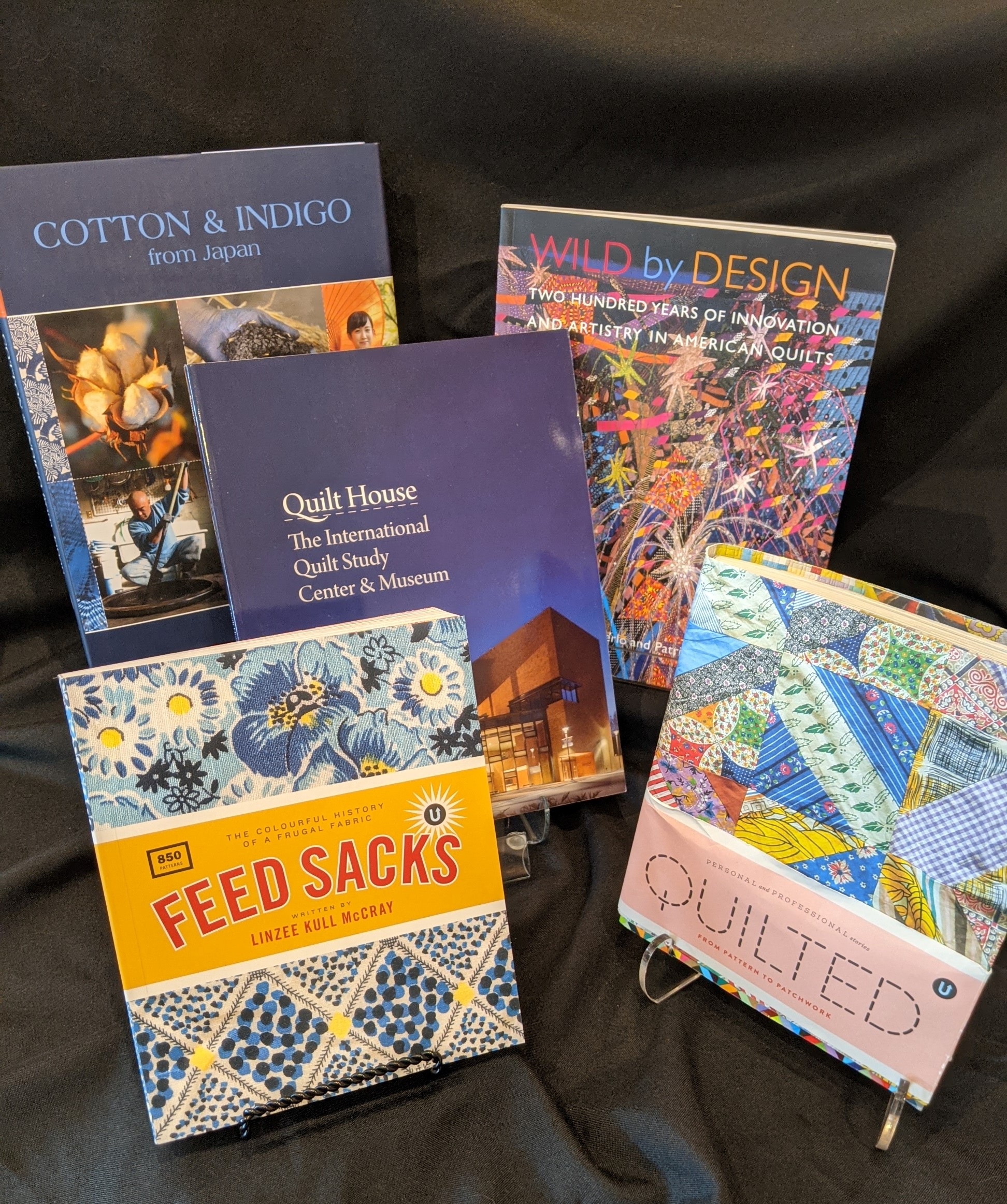 Artfully arranged stack of quilt related books